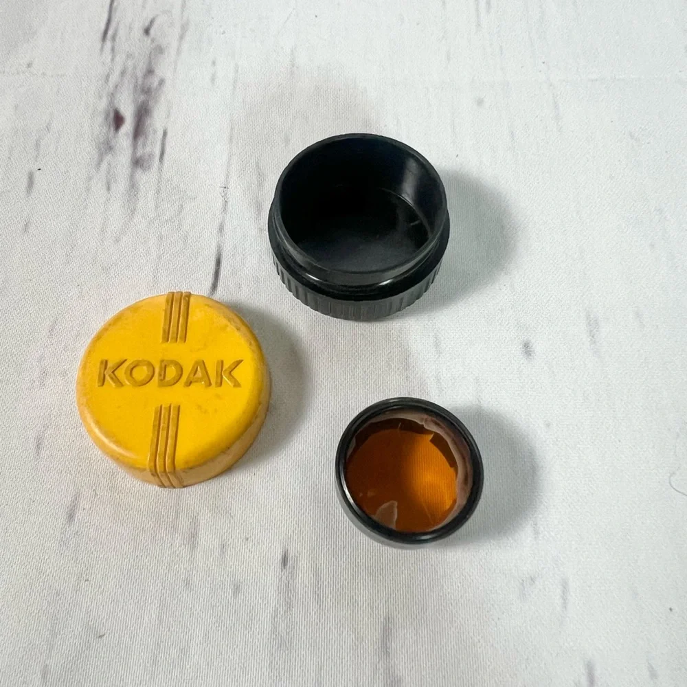 Vintage Camera Accessory Bundle: Nikon Glass Filter & Kodak Lens and Case